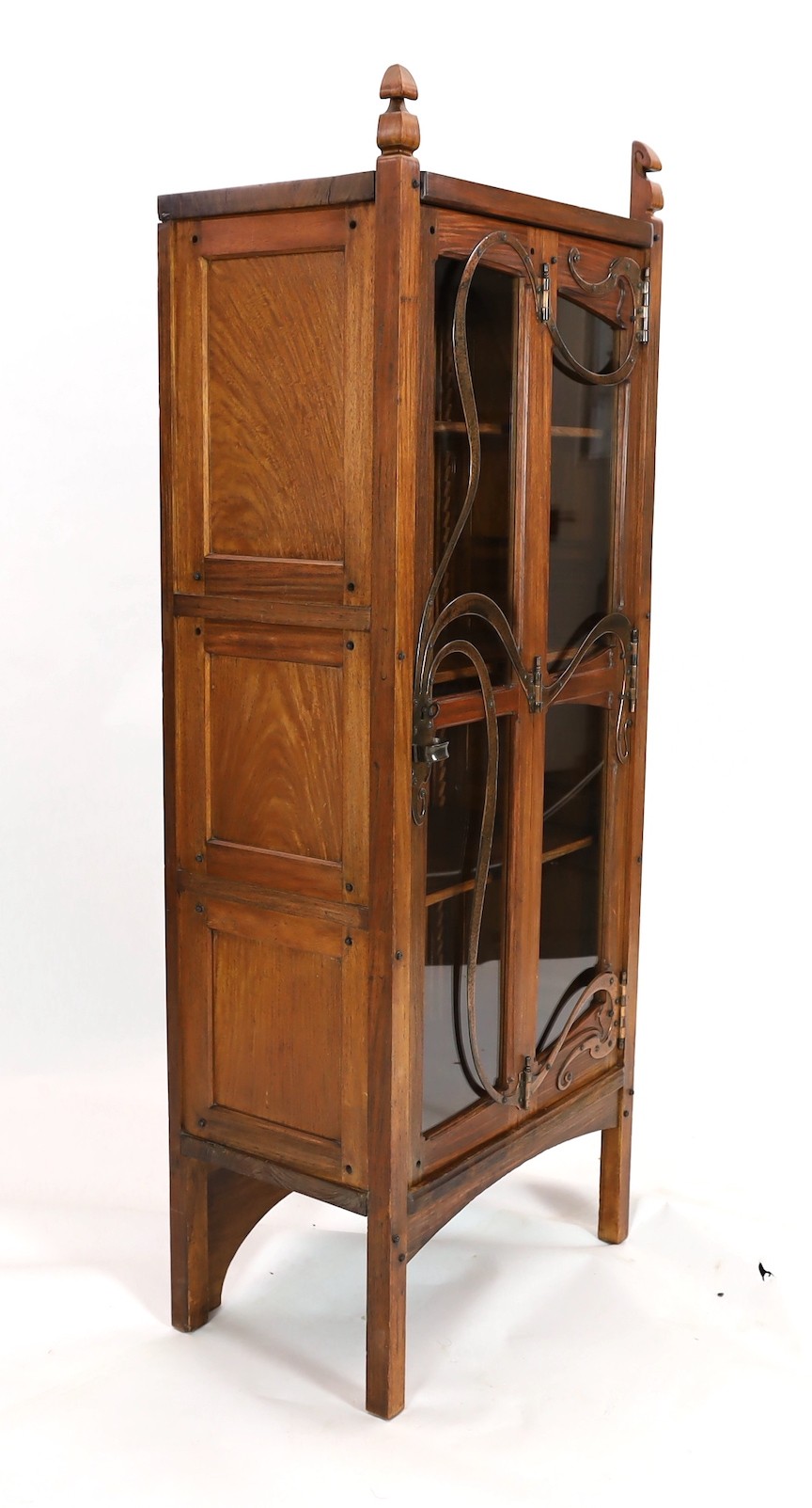 Gustave Serrurier-Bovy (Belgian 1858–1910). An Art Nouveau copper mounted red narra wood vitrine, width 68cm, depth 40cm, height 174cm